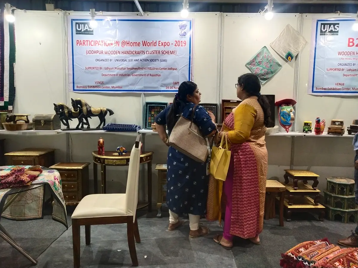 Visitors browsing the cluster's stall at the @Home World Expo, 2019.
