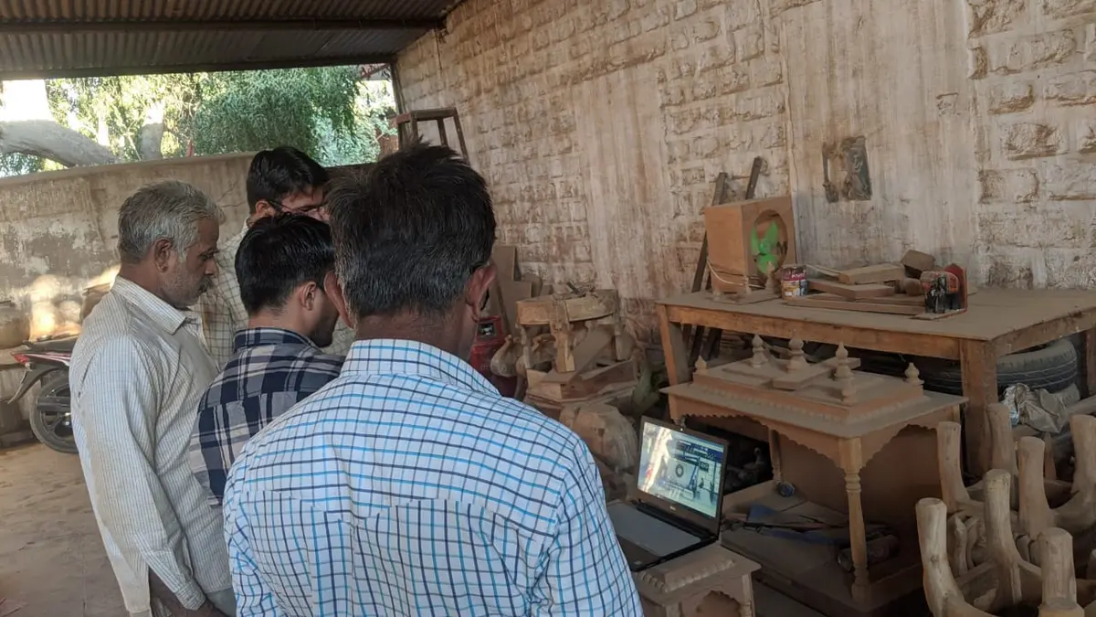 Reviewing a new furniture design on-site at the workshop.