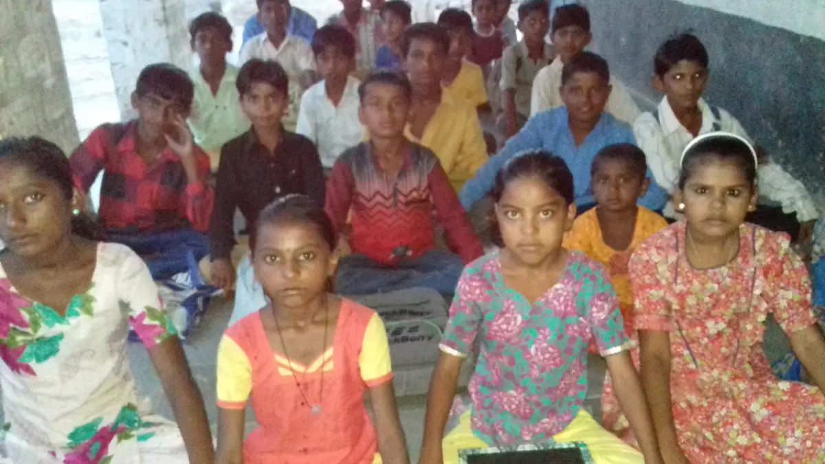 Children gathered for a community session at the settlement, later that same April 2017.
