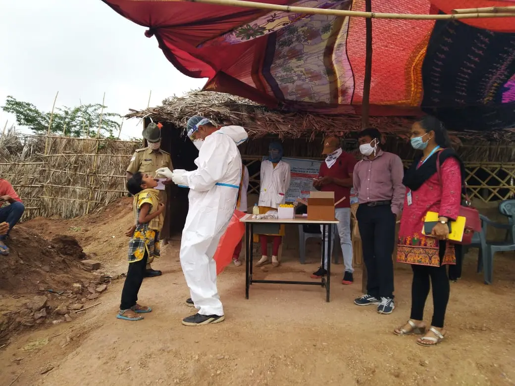 COVID-19 testing conducted on-site at the settlement, with local police in attendance.