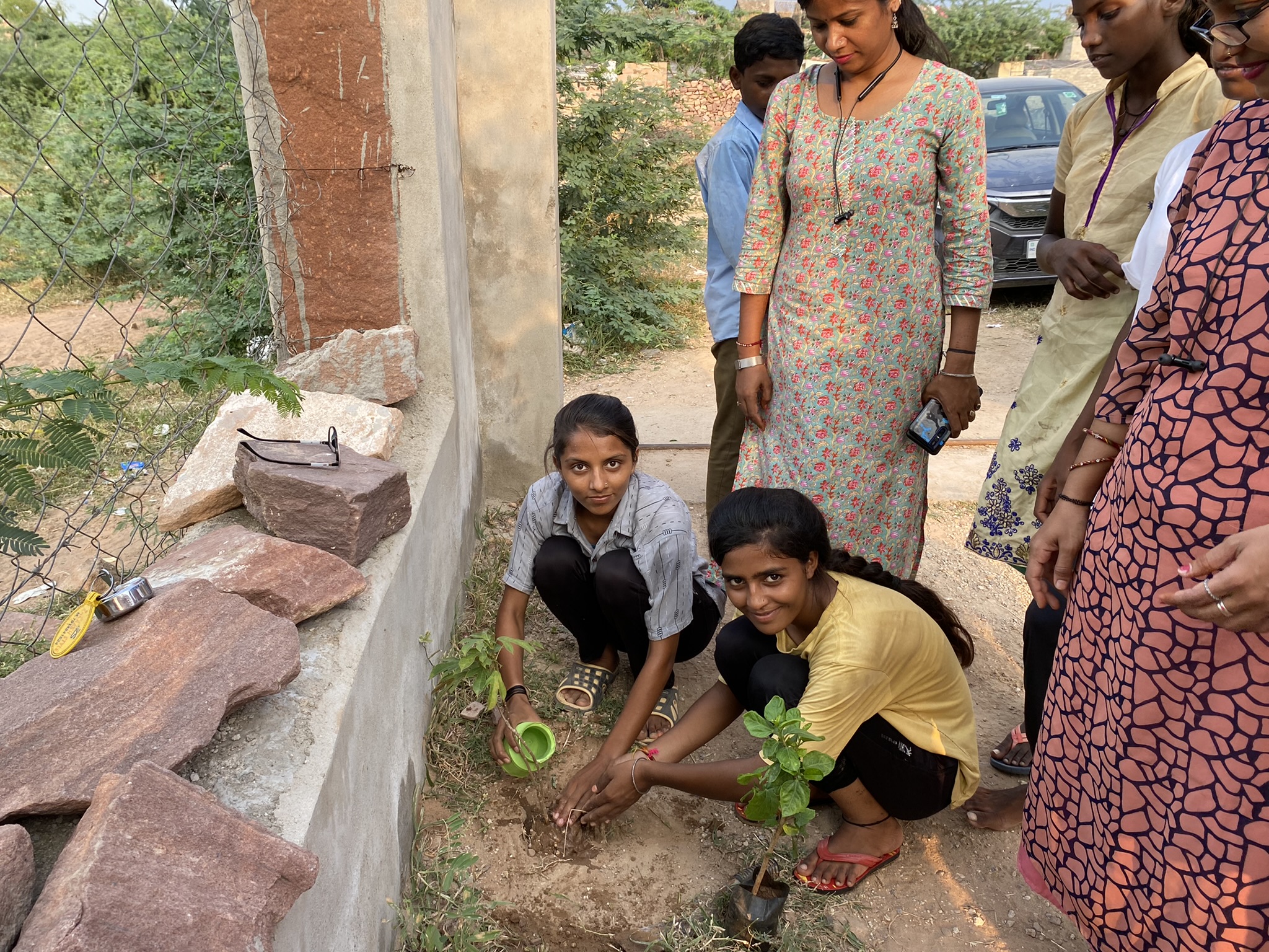 Community members participating in a plantation drive