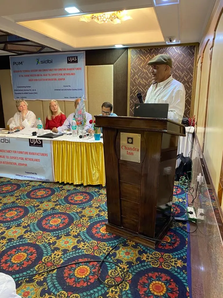 UJAS founder Hindu Singh Sodha addresses the seminar, with the visiting PUM experts on the panel.