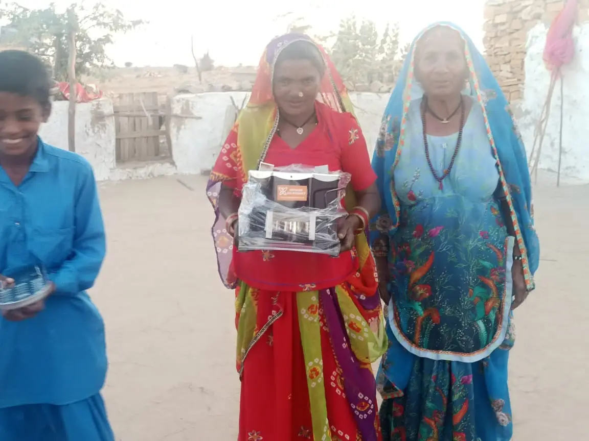 A solar cooker handed over to residents of Narsing Oad Basti.